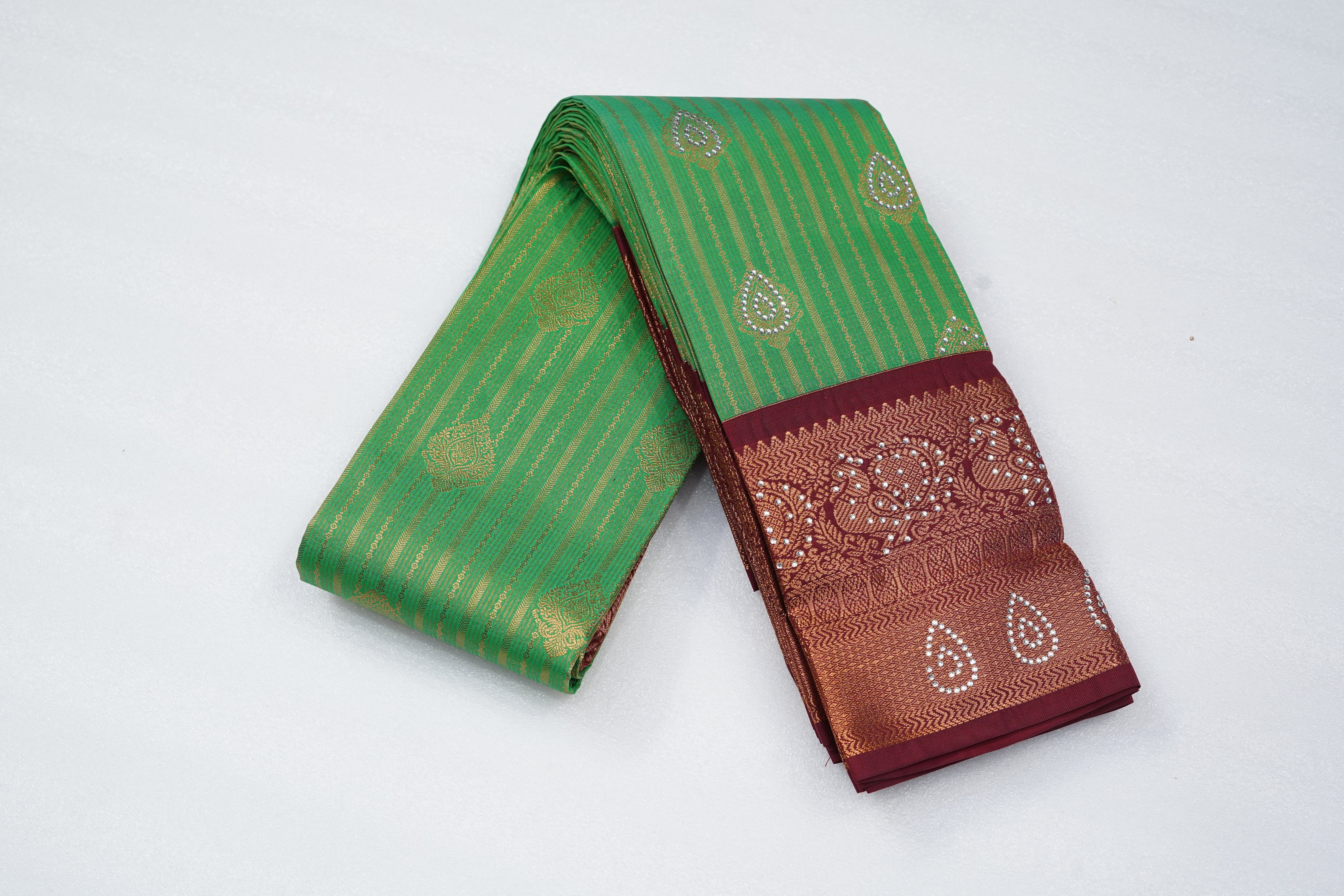 Green Art Silk Saree with Gold Stripes, Paisley Buttas and Rich Maroon Zari Border