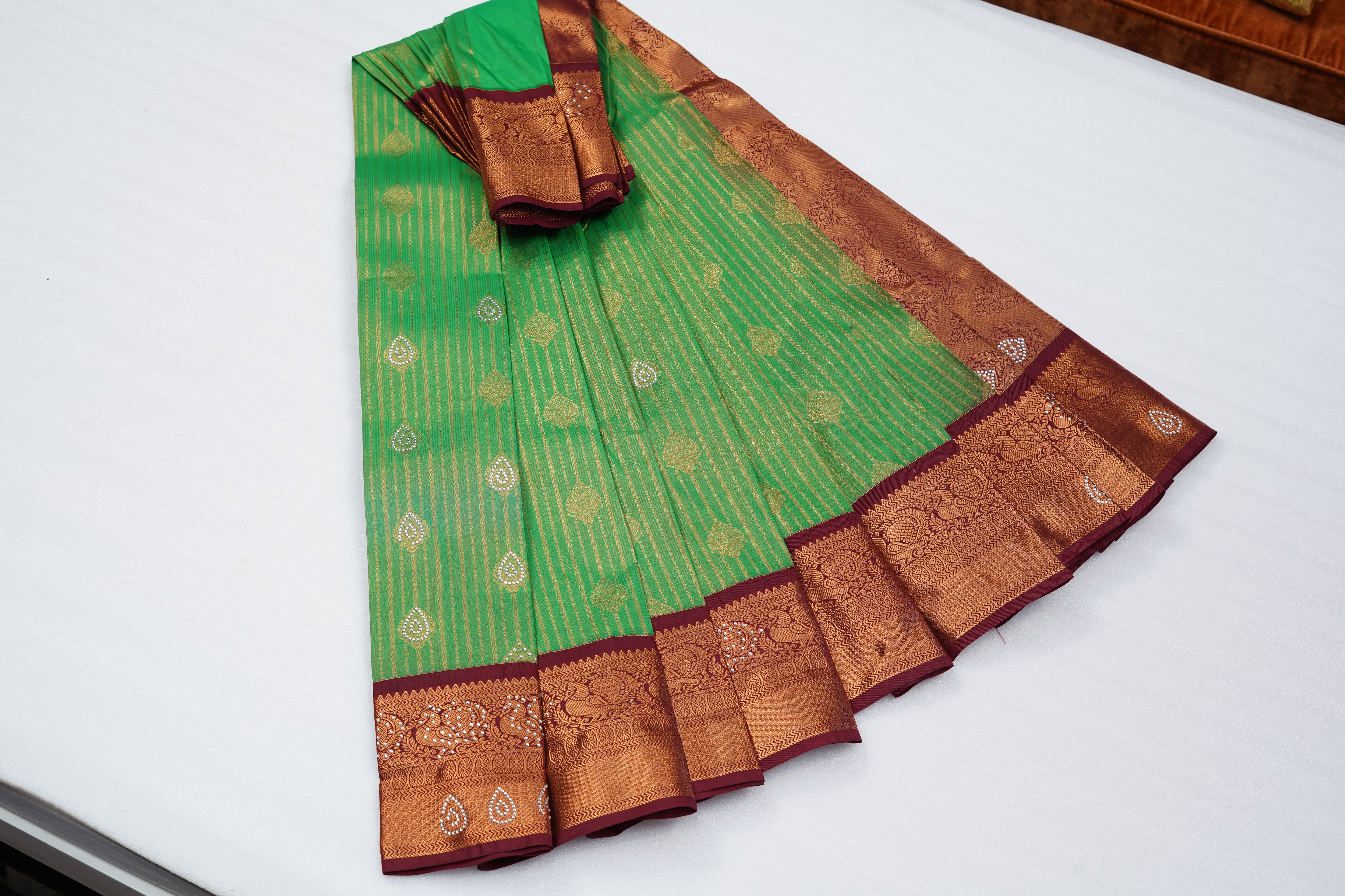 Green Art Silk Saree with Gold Stripes, Paisley Buttas and Rich Maroon Zari Border
