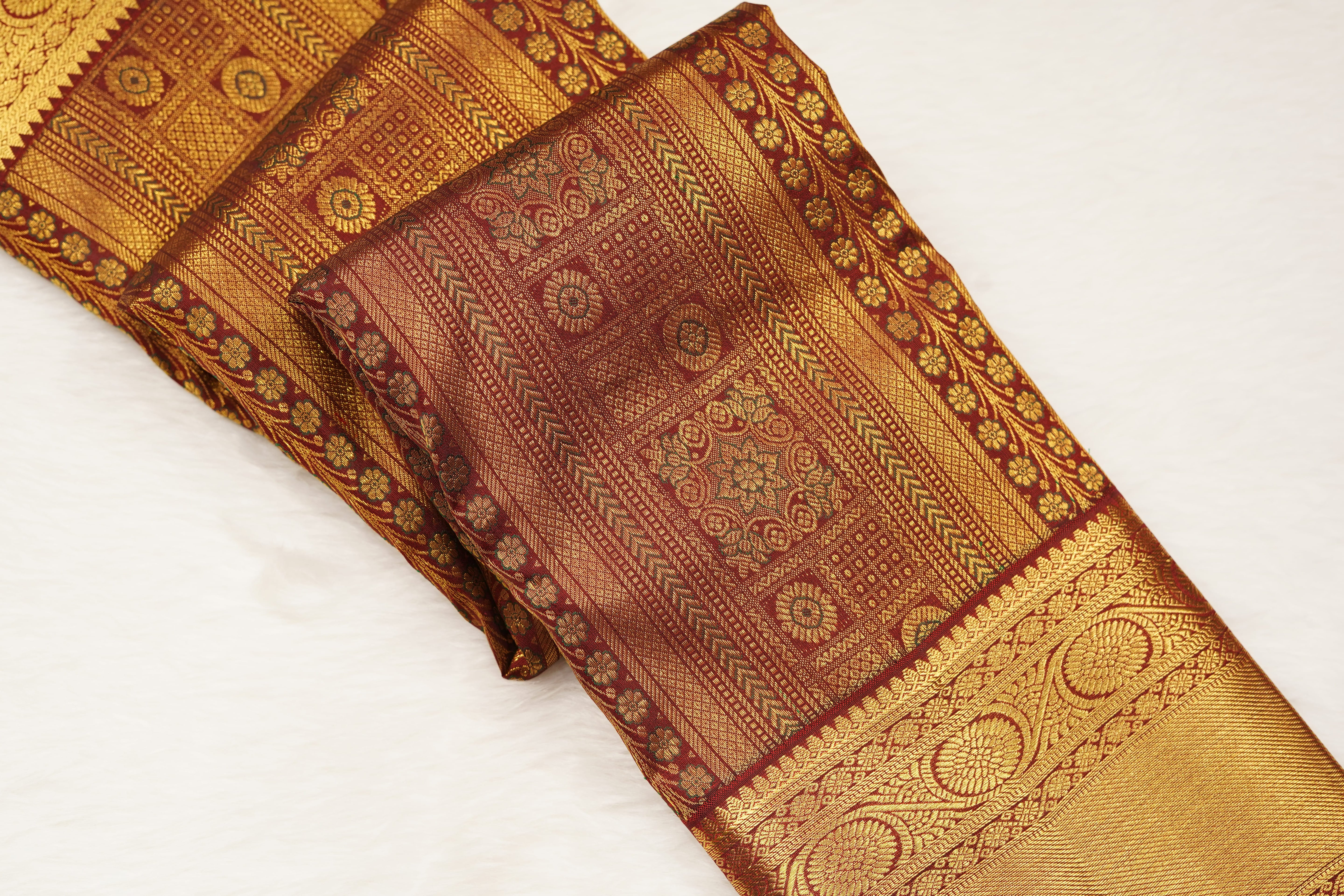 Maroon Pure Silk Saree with Intricate Zari Checks, Floral Motifs & Grand Traditional Pallu
