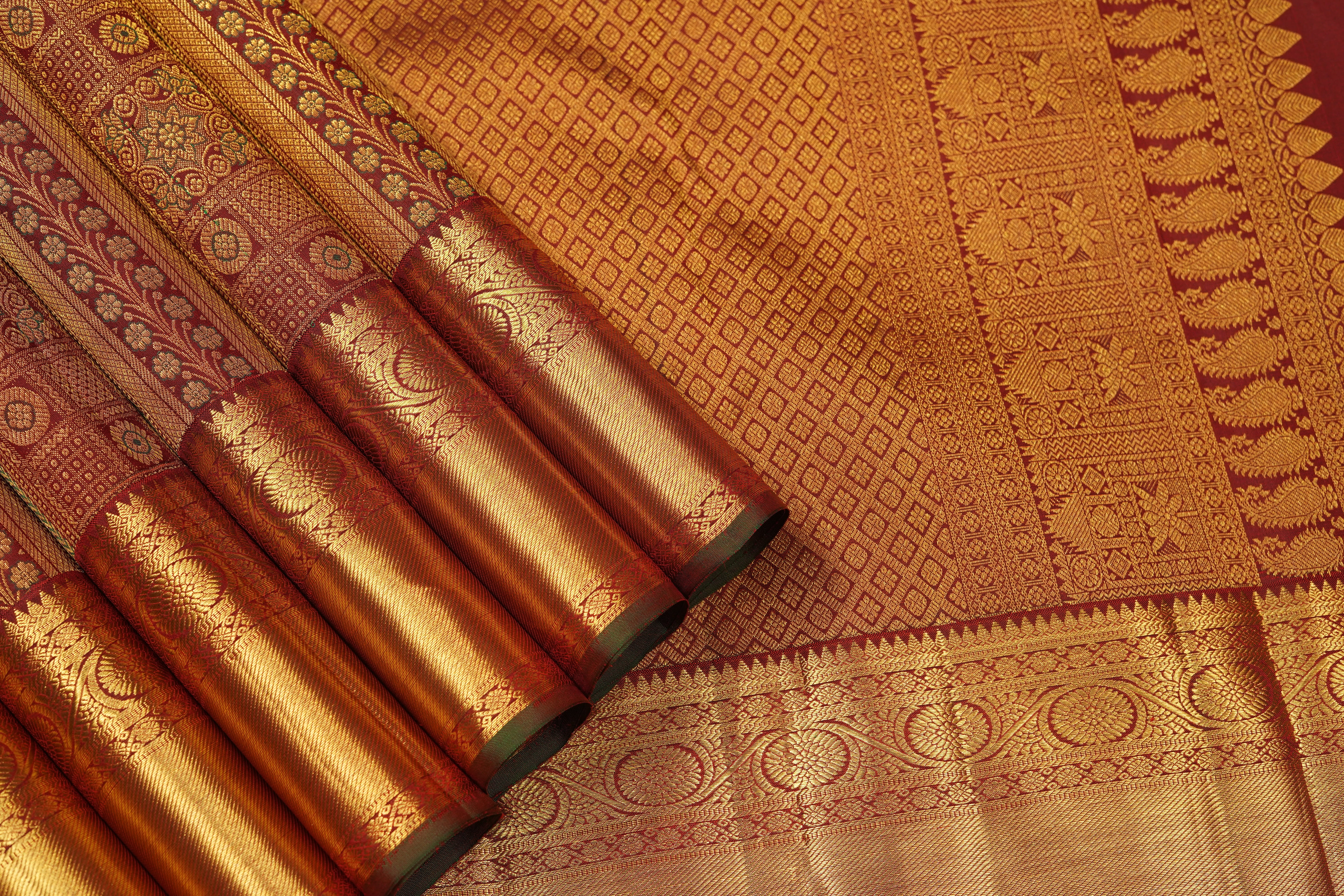 Maroon Pure Silk Saree with Intricate Zari Checks, Floral Motifs & Grand Traditional Pallu
