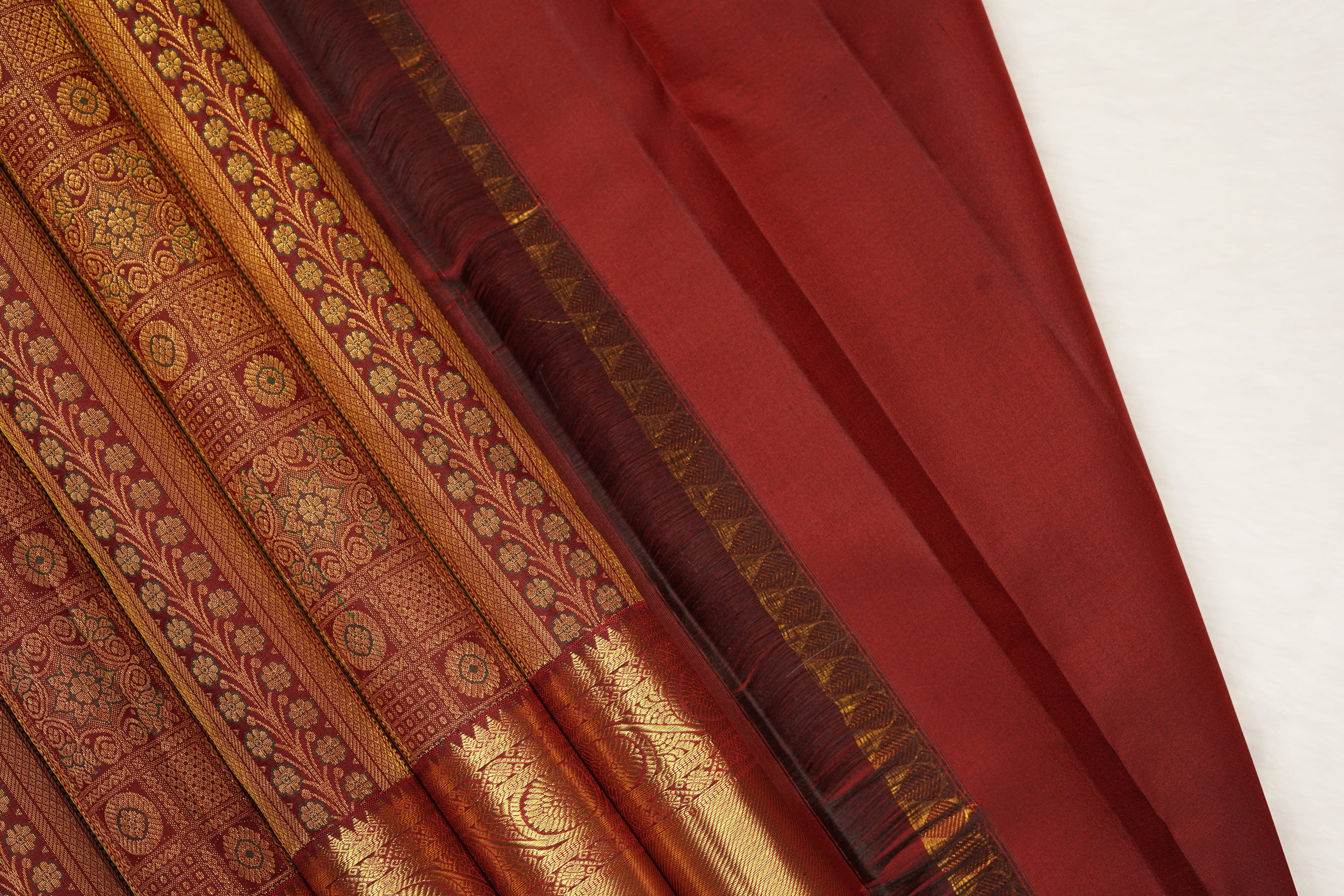 Maroon Pure Silk Saree with Intricate Zari Checks, Floral Motifs & Grand Traditional Pallu