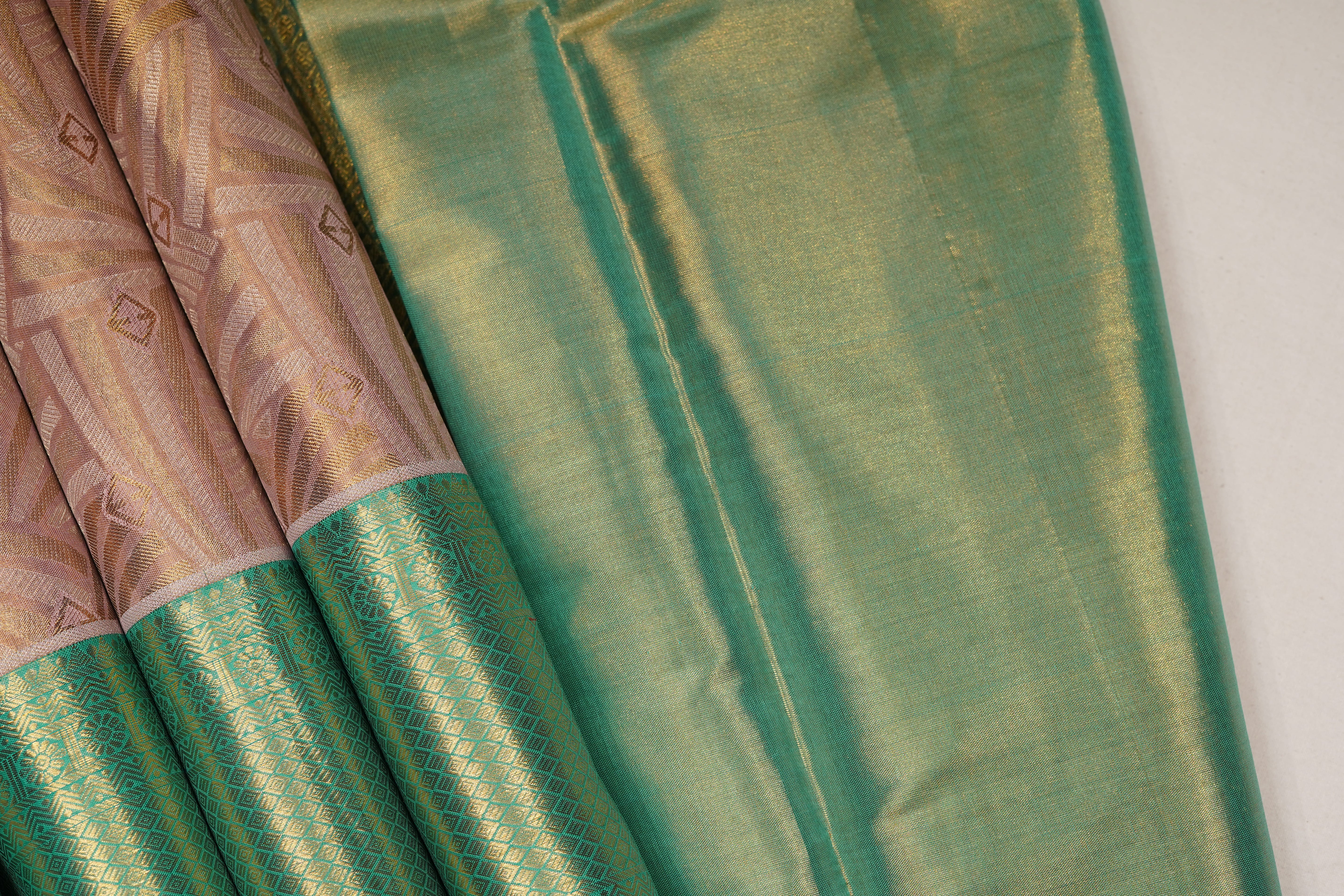Peach & Sea Green Pure Silk Saree with Geometric Jacquard Body and Rich Zari Border
