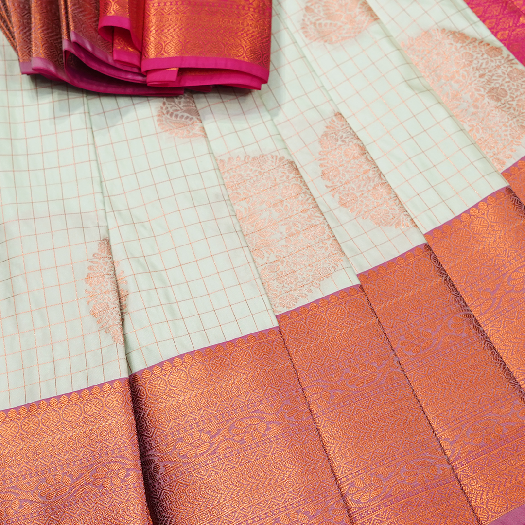 Pink Art Silk Saree with Bird Motifs and Contrast Green Zari Border