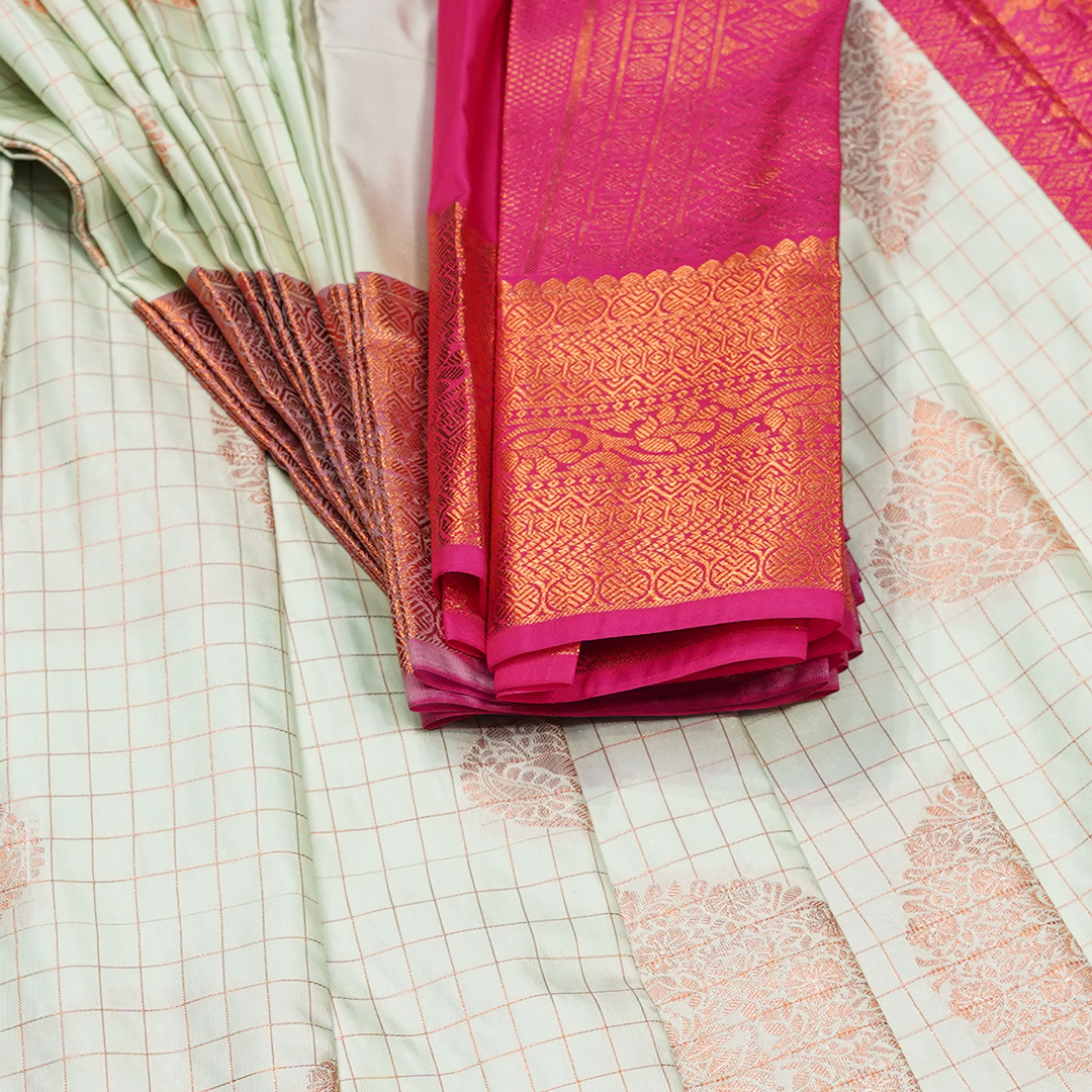 Pink Art Silk Saree with Bird Motifs and Contrast Green Zari Border